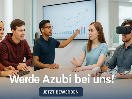 Gruppenbild mit fünf Personen die an einem Tisch sitzen. Eine lächelnde Frau mit Kopftuch und ein junger Mann im roten Hoodie sitzen links im Bild an einem Laptop. In der Mitte befindet sich ein junger Mann, der mit einer Frau zu seiner rechten spricht. Rechts im Bild sitzt ein Mann mit einer VR-Brille. Es ist ein Bildschirm mit Graphen auf der Anzeige im Hintergrund zu sehen.